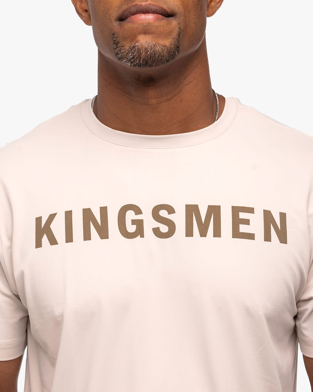 Kingsmen Golf Legacy Crewneck T-Shirt oatmeal on person front zoomed